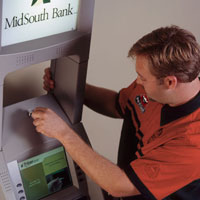Locksmith Working On ATM